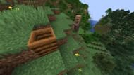 Unemployed villagers will automatically pathfind through a hill if a jobsite block is placed at the top in Minecraft (Image via Mojang)